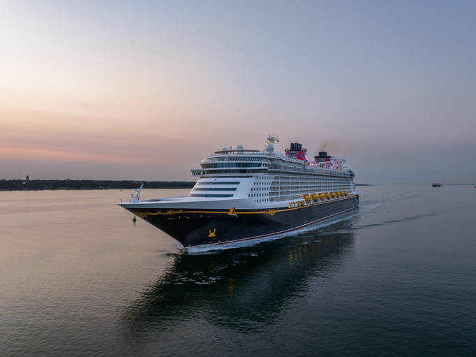Aerial view of a cruise ship entering a harbor.