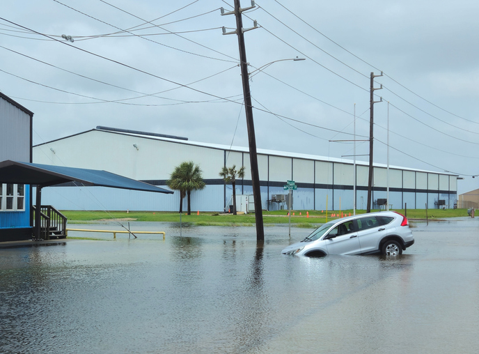 Galveston, Texas, USA - June 19, 2024: Car disabled after driving In flooded streets after heavy rains from Tropical Storm Alberto.