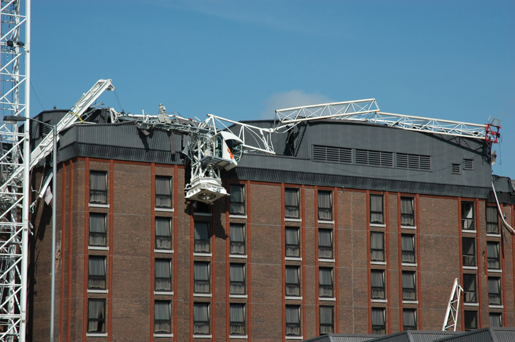 Fallen scaffolding on top of a brown building